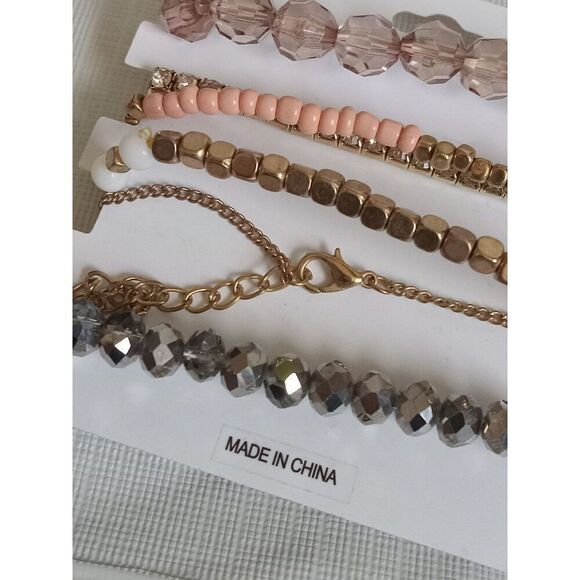 Charlotte Russe Set of 6 Gold Toned and Pink Assorted Beaded Elastic Bracelets - Picture 5 of 10